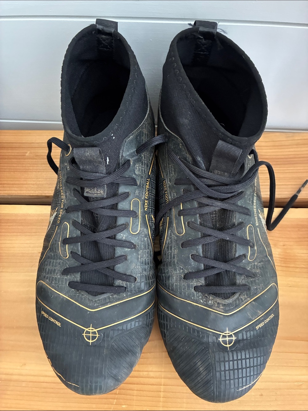 Nike Kids Black and Gold Athletic Cleats